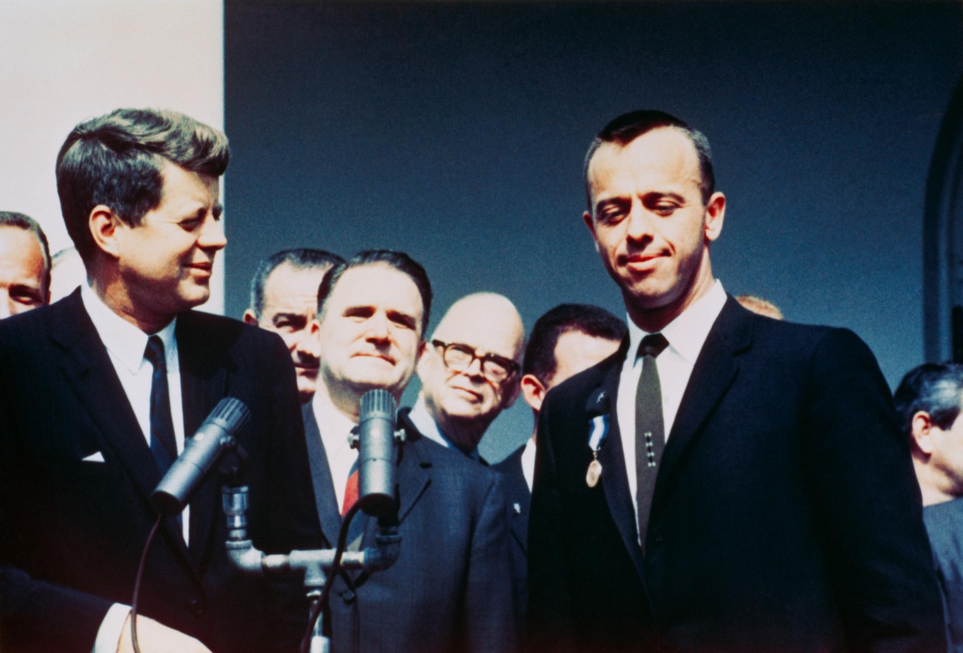 Alan Shepard shakes hands with president Kennedy after becoming first American in space