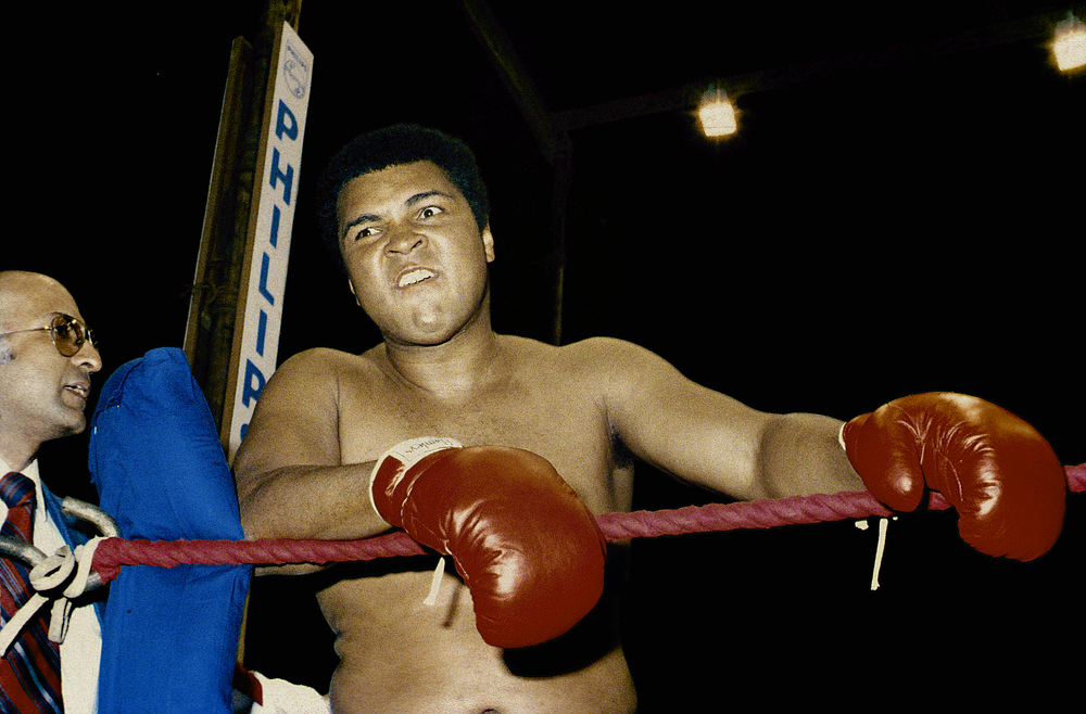 Muhammad Ali in boxing gloves and in the ring