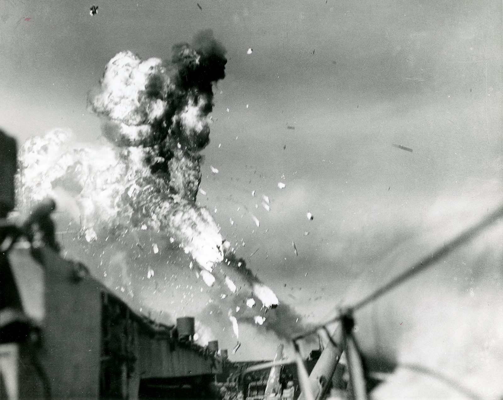 Japanese kamikaze pilot attacks naval warship resulting in explosive damage