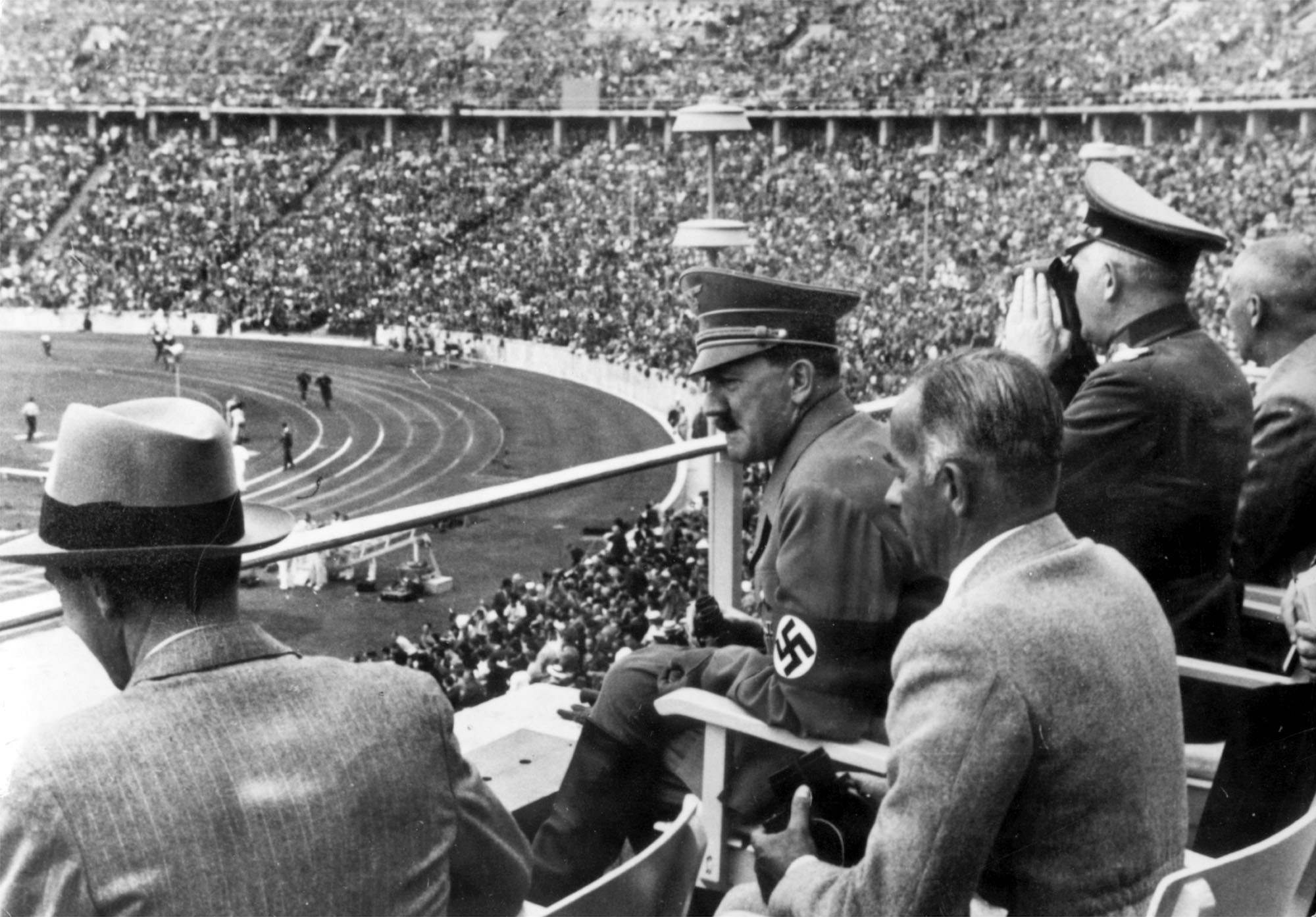 Fuhrer hitler and nazi regime watch the 1936 olympic games and first torch relay